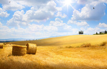 Italy Summer Or Autumn Golden Countryside Landscape, Wheat Straw Bales And Farmland Over Sunset Sky