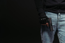 Cropped View Of African American Hooligan Holding Handgun Isolated On Black