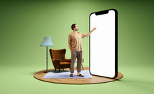 Photo And 3d Illustration Of Man Standing Next To Huge 3d Model Of Smartphone With Empty White Screen Isolated On Green Background. Mockup For Ad