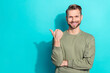 Leinwandbild Motiv Photo of millennial blond funny guy index promo wear khaki sweater isolated on teal color background