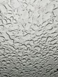 Vertical grayscale closeup of the rainfall water pattern.