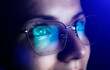 © Vadym - Girl works on internet. Reflection at the glasses from laptop..Close up of woman's eyes with black female glasses for working at a computer. Eye protection from blue light and rays.