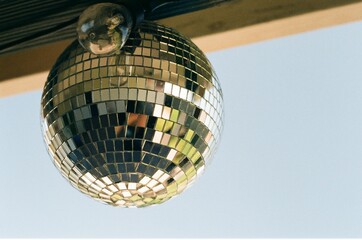 Poster - Closeup shot of a shiny disco ball in a blurred background