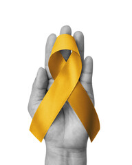 Wall Mural - Childhood cancer awareness gold ribbon isolated on white background with clipping path. Golden bow color for Embryonal Rhabdomyosarcoma, Neuroblastoma and Osteosarcoma awareness