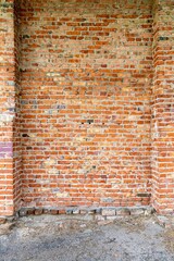 Wall Mural - Texture of the wall of an industrial building made of red bricks with columns.