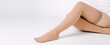 © mlphoto - Beige compression stockings isolated on a white background