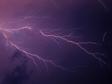 Bright Lightning On The Blue Sky At Night. Background Image With Lightning