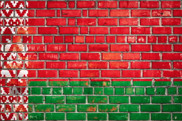 Belarusian flag on a grunge brick background.