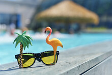 Sunglasses On The Background Of The Pool