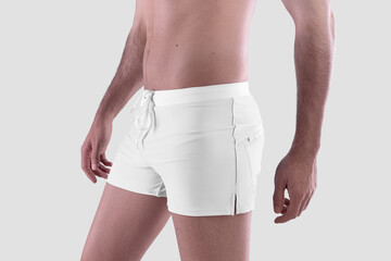 Canvas Print - Mockup of white men's boxers on a man close-up, empty panties, isolated on background, front, side view.