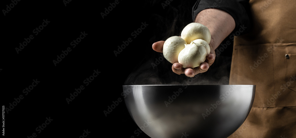 Cheesemaker, showing freshly made mozzarella. The homemade cheese maker ...
