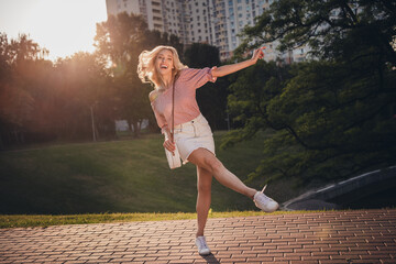 Wall Mural - Full body portrait of gorgeous excited lady have fun walking street free time outside