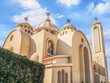 Exterior of modern El sama Eyeen Coptic Church in Sharm El Sheikh, Egypt. Facade of an Egyptian Orthodox temple against a blue sky