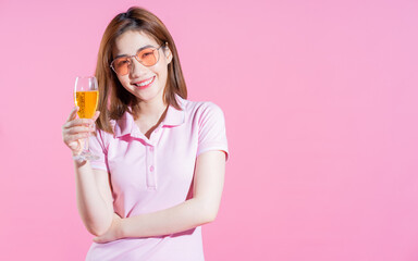 Photo of young Asian girl posing on pink background