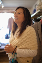 Happy Senior Woman In Cable Knit Shawl In Shop