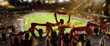 Leinwandbild Motiv Back view of football, soccer fans cheering their team with colorful scarfs at crowded stadium at evening time. Concept of sport, support, competition. Out of focus effect