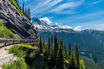 Wall Mural - A view looking back from a train on the White Pass and Yukon railway on a bridge near Skagway, Alaska in summertime