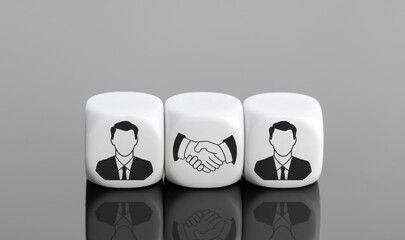 Agreement, partnership or deal concept. Businessman icon and handshake Icon on white blocks. Copy space