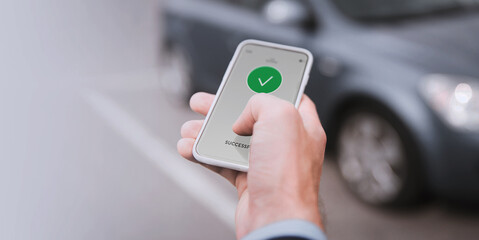 Wall Mural - carsharing, transportation and technology concept - close up of hand with on smartphone screen over car on background