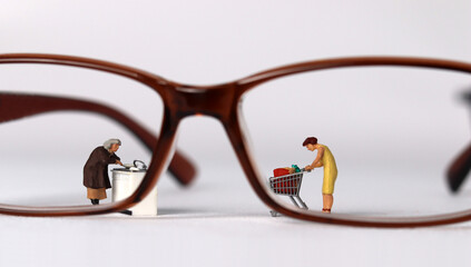 Wall Mural - Business concept with glasses and miniature people.
