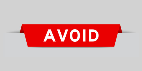 Red color inserted label with word avoid on gray background