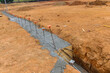 The construction site of strip foundation reinforcement frame for a reinforced concrete house building