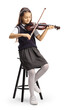 © Ljupco Smokovski - Full length shot of a schoolgirl sitting on a chair and playing a violin