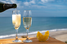 Outdoor Breakfast With Spanish Cava Sparkling Wine And Pineapple With View On Blue Sea And Sandy Beach In Marbella, Costa Del Sol Vacation Destination, Andalusia, Spain