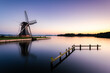 Windmill at blue hour from Paterswoldsemeer near Groningen city, Netherlands.
