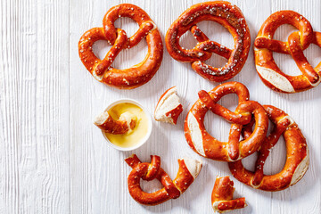 Canvas Print - pretzels in the form of knot with cheese sauce