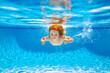 © Olena - Child swim under water in sea. Kid swimming in pool underwater. Happy boy swims in sea underwater, active kid swimming, playing and diving, children water sport.