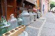 old vintage glass and metal bottles and jars at sale in a street market in Puebla city, Mexico