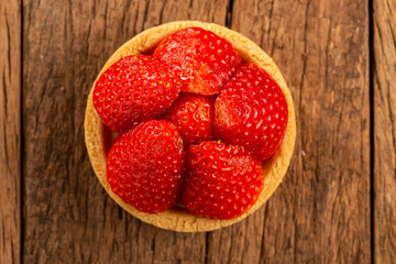 Canvas Print - Tasty strawberry tartlet on the table.