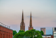 Towers Of Holy Trinity Church At Sunset In Coventry