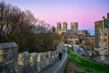 The City Of York In England With Its Medieval Wall And The York Minster At Sunset