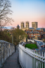 The City Of York In England With Its Medieval Wall And The York Minster At Sunset - Vertical View
