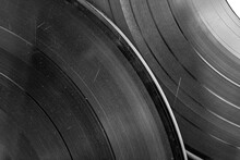 Vinyl Records Close-up Black And White Image. Vinyl Background. Original Authentic Scratched Old Vinyl.