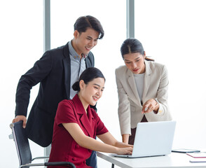 Group of millennial Asian Indian multinational multicultural male and female businessman businesswoman teamwork in formal suit sitting smiling brainstorming meeting together in office conference room.