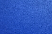 Texture Of Wall With Coarse Vibrant Blue Roughcast Finish