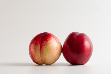 Nectarine. Two Nectarines isolated nectarines on white background. A pair of nectarine