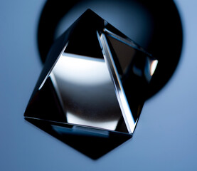 Wall Mural - Abstract still life image with geometric objects. Glass pyramid in a low key.