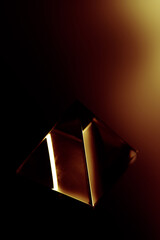 Wall Mural - Dark abstract background with a shiy object. Glass object in the dark.