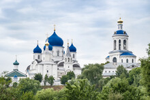 Blue Domes Of Holy Bogolyubovsky Monastery Against Cloudy Sky
