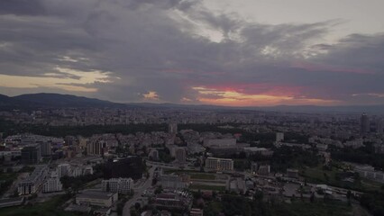Wall Mural - Evening sunset and dark clouds over the skyline of the city
