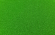 The Background Is Made Of Green Material. Fabric For Sewing Clothes In A Dark Shade. Texture
