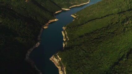 Wall Mural - Aerial video. View of the beautiful blue mountain lake. Piva lake