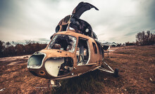 Abandoned Soviet Union Helicopter With Camouflage Color Cabin At The Airfield