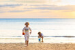 © famveldman - Kids play on tropical beach. Sand and water toy.
