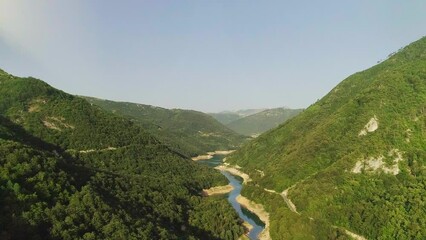 Wall Mural - Aerial video. View of the beautiful blue mountain lake. Piva lake