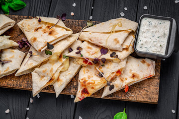 Wall Mural - Fried pita bread with cheese and tomatoes